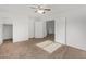 Spacious bedroom features neutral carpet and access to the adjoining bathroom at 4831 N 93Rd Dr, Phoenix, AZ 85037