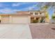 Charming two-story home with a red tile roof, three-car garage, and desert landscaping at 4831 N 93Rd Dr, Phoenix, AZ 85037