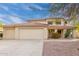 Charming two-story home with a red tile roof, three-car garage, and desert landscaping at 4831 N 93Rd Dr, Phoenix, AZ 85037