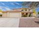 Charming two-story home with a red tile roof, three-car garage, and desert landscaping at 4831 N 93Rd Dr, Phoenix, AZ 85037