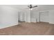 Bright living room offers neutral carpeting, fresh paint, and an open floor plan at 4831 N 93Rd Dr, Phoenix, AZ 85037