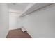 Empty walk-in closet with carpeted floors and wooden rod with shelving for optimal storage at 4831 N 93Rd Dr, Phoenix, AZ 85037