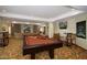 Game room with a pool table, cozy seating area, fireplace, and two TVs for entertainment at 5350 E Deer Valley Dr # 1419, Phoenix, AZ 85054