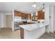 Bright kitchen featuring stainless steel appliances, ample counter space, and wooden cabinets at 5350 E Deer Valley Dr # 1419, Phoenix, AZ 85054