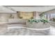 Beautiful lobby with a stone-decorated water feature, elegant greenery, and comfortable seating area at 5350 E Deer Valley Dr # 1419, Phoenix, AZ 85054