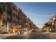 Street with commercial buildings and restaurants with string lights creating a warm and inviting atmosphere at 5350 E Deer Valley Dr # 1419, Phoenix, AZ 85054