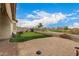Private backyard featuring a putting green, stone landscaping, and a paver patio for entertaining at 606 S 124Th Ave, Avondale, AZ 85323
