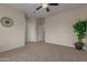 Bedroom boasts plush carpeting, neutral walls, and ample closet space at 606 S 124Th Ave, Avondale, AZ 85323
