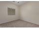Neutral bedroom featuring carpet floors and a window with blinds at 606 S 124Th Ave, Avondale, AZ 85323