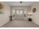 Inviting bedroom features large windows, plush carpeting, and a decorative lamp at 606 S 124Th Ave, Avondale, AZ 85323