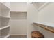 Walk-in closet with shelving and hanging rods provides ample storage space at 606 S 124Th Ave, Avondale, AZ 85323