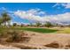 Picturesque view of the golf course creating a scenic backdrop for the community at 606 S 124Th Ave, Avondale, AZ 85323