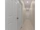 Hallway with neutral walls and tile floors that create a bright and airy feel at 606 S 124Th Ave, Avondale, AZ 85323