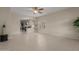 Spacious living room with tile flooring and open layout, showcasing natural light at 606 S 124Th Ave, Avondale, AZ 85323