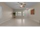 Open-concept living area with ample natural light and neutral decor, tiled floors at 606 S 124Th Ave, Avondale, AZ 85323