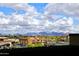 Exterior shot with mountain views, palm trees, retail shops and a partially cloudy sky at 6166 N Scottsdale Rd # C4004, Paradise Valley, AZ 85253