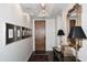 Foyer with dark wood floors, modern lighting, and elegant decor at 6166 N Scottsdale Rd # C4004, Paradise Valley, AZ 85253