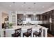 Kitchen with white counters, pendant lights and dark wood cabinets at 6166 N Scottsdale Rd # C4004, Paradise Valley, AZ 85253