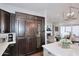 Bright kitchen features custom wood cabinetry, a wine cooler and state of the art appliances at 6166 N Scottsdale Rd # C4004, Paradise Valley, AZ 85253