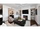 Inviting living room with fireplace, TV, and stylish decor at 6166 N Scottsdale Rd # C4004, Paradise Valley, AZ 85253