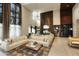 Elegant community lounge featuring a large sectional sofa, fireplace, and chandelier at 6166 N Scottsdale Rd # C4004, Paradise Valley, AZ 85253