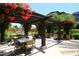 Charming outdoor patio with shaded seating areas and lush landscaping at 6166 N Scottsdale Rd # C4004, Paradise Valley, AZ 85253