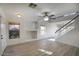 Bright living room features hard surface floors, a large window, and modern light fixtures at 6608 W Whispering Wind Dr, Glendale, AZ 85310