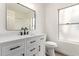 Charming bathroom featuring granite countertops, modern black hardware, and freshly painted walls at 7056 W Caron Dr, Peoria, AZ 85345