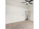 A neutral bedroom features a vaulted ceiling, neutral carpet, and adjoining door at 7056 W Caron Dr, Peoria, AZ 85345