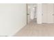 This bedroom features neutral carpet and fresh white paint and includes entry to a closet and hallway at 7056 W Caron Dr, Peoria, AZ 85345