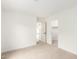 Clean bedroom with neutral carpet and walls featuring a walk-in closet and ample lighting at 7056 W Caron Dr, Peoria, AZ 85345