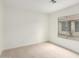 This cozy bedroom has neutral carpet, freshly painted walls, and a new window at 7056 W Caron Dr, Peoria, AZ 85345