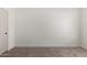 A charming bedroom with neutral colored walls, new carpet and crisp white trim at 7056 W Caron Dr, Peoria, AZ 85345