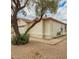 Charming home features a well-maintained stucco exterior, a garage, and low-maintenance desert landscaping at 7056 W Caron Dr, Peoria, AZ 85345