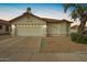 Charming single-Gathering home featuring a two-car garage and low maintenance desert landscaping at 7056 W Caron Dr, Peoria, AZ 85345