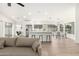 Open floor plan featuring a kitchen island with barstool seating and stainless steel appliances at 7056 W Caron Dr, Peoria, AZ 85345