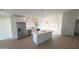Bright kitchen features an island, stainless steel appliances, and plenty of cabinet storage at 7056 W Caron Dr, Peoria, AZ 85345