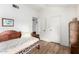 Bedroom showcasing laminate flooring, light walls, and a daybed with access to a closet at 7223 N 14Th St, Phoenix, AZ 85020