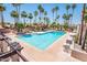 Beautiful community pool with clear blue water, many palm trees and lounge seating at 7232 N Via Camello Del Norte -- # 3, Scottsdale, AZ 85258