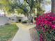 Picturesque walkway surrounded by lush greenery, vibrant flowers, and desert landscaping at 7232 N Via Camello Del Norte -- # 3, Scottsdale, AZ 85258