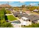 Aerial view of a home with a backyard oasis including a pool, spa, and pergola-covered patio for outdoor relaxation at 7417 E Bonita Dr, Scottsdale, AZ 85250