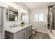 Modern bathroom with dual sinks, marble countertop, vanity, mirror and tiled shower at 7417 E Bonita Dr, Scottsdale, AZ 85250