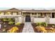 Inviting front entrance with a stone pathway, lush landscaping, and a cozy porch at 7417 E Bonita Dr, Scottsdale, AZ 85250