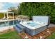Backyard with hot tub, pool, and landscaping, creating a relaxing outdoor oasis at 7417 E Bonita Dr, Scottsdale, AZ 85250