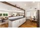 Kitchen island with counter seating offers views into the living and dining areas at 7417 E Bonita Dr, Scottsdale, AZ 85250