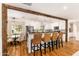 Kitchen bar with seating, view into the kitchen, and an open flow to the dining area at 7417 E Bonita Dr, Scottsdale, AZ 85250