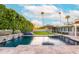 Gorgeous backyard pool with water feature, spa, umbrella, and spacious patio perfect for outdoor living at 7417 E Bonita Dr, Scottsdale, AZ 85250