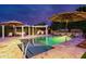A beautiful pool area with lounge seating, travertine tile, and a manicured backyard offers a relaxing oasis at 7417 E Bonita Dr, Scottsdale, AZ 85250