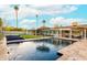 Inviting backyard pool area with comfortable seating, lush greenery, and a relaxing ambiance at 7417 E Bonita Dr, Scottsdale, AZ 85250