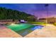 A backyard oasis with a pool, hot tub, lounge area, privacy landscaping, and lush green grass awaits at 7417 E Bonita Dr, Scottsdale, AZ 85250